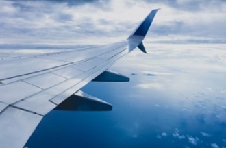 Aircraft wing blue sky